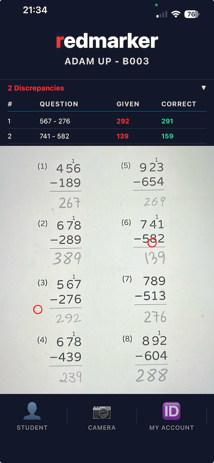 Marked worksheet on screen: several answers highlighted in red where the child's working looks wrong.